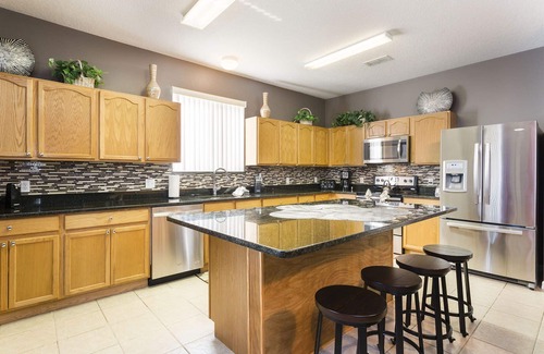 Windwood Bay House | Discover a Dream Villa Near Disney with Pool & Theater