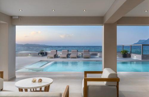 Nopigia Villa | Beachfront Bliss at Villa EOS with Pool and Ocean Views