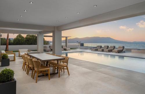 Nopigia Villa | Beachfront Bliss at Villa EOS with Pool and Ocean Views