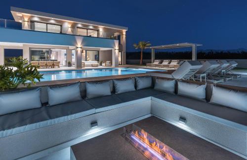 Nopigia Villa | Beachfront Bliss at Villa EOS with Pool and Ocean Views