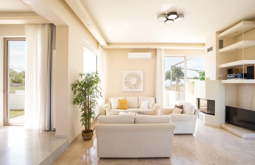 Tria Monastiria Villa | Exquisite Villa with Heated Pool and Ocean View Near Beach
