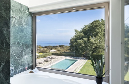 Tria Monastiria Villa | Exquisite Villa with Heated Pool and Ocean View Near Beach