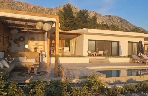 Paleros Villa | Luxury villa with large terrace, lounge area, pool, jacuzzi + magnificent sea view.