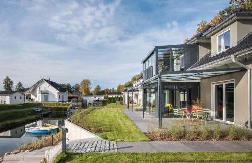 Krakow am See Apartment | Elegant Waterfront Retreat with Private Boat Access