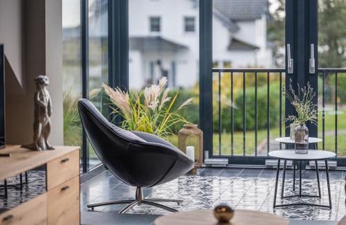 Krakow am See Apartment | Elegant Waterfront Retreat with Private Boat Access