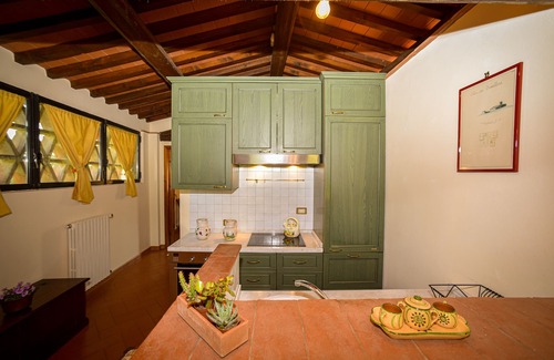 San Casciano in Val di Pesa Cottage | Grindstone Farmhouse: Enjoy Poolside Relaxation and Spa