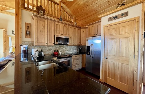 Cranberry Falls Cabin | Pet-Friendly Maggie Valley Cabin with Deck & Mountain Views
