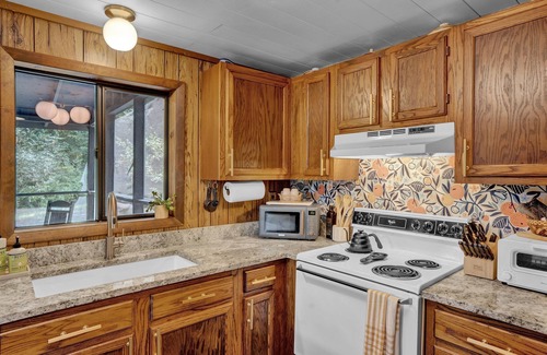 Pocono Pines Cabin | Riverfront Retreat: Cozy Cabin with Spa & Pet-Friendly Amenities