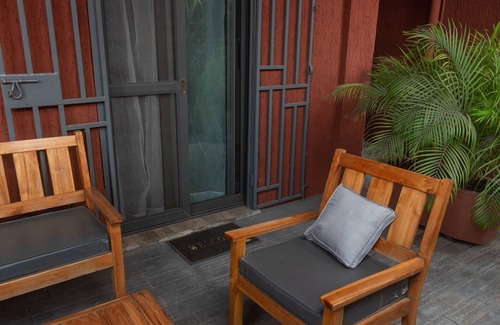 Lome Apartment | Elegant Villa with Oceanfront Views and Spacious Terrace