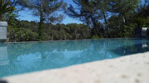 Eoures Villa | Sunny Retreat Among Pines: Pool & Family-Friendly Stay