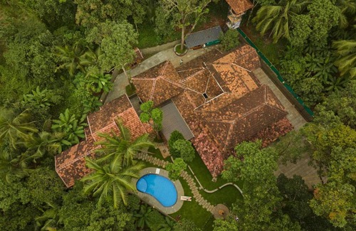 Tirur Resort | Malabar Kovilakam: Family-Friendly Retreat with Pool & Spa