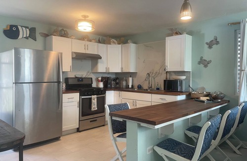 Bajo House | Cozy Beach House with Fireplace and Ocean View Amenities