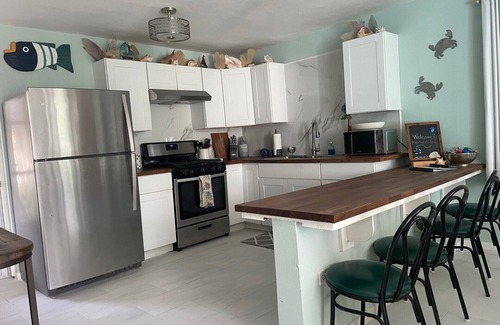 Bajo House | Cozy Beach House with Fireplace and Ocean View Amenities