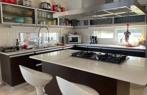 Gualeguaychu House | Elegant 5-Bedroom Suite in Scenic Country Golf Retreat