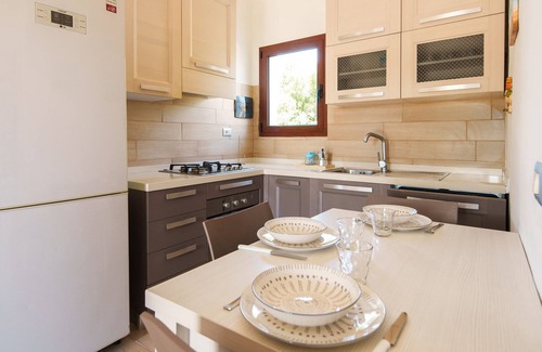 San Teodoro City Centre Apartment | Discover Maresole La Cinta: Family-Friendly Getaway