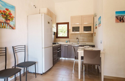 San Teodoro City Centre Apartment | Discover Maresole La Cinta: Family-Friendly Getaway