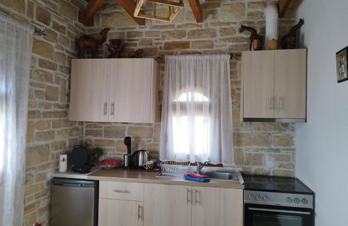 Faistos Apartment | Oceanfront Marianna Sea View Stone House - Guest Rated 10/10