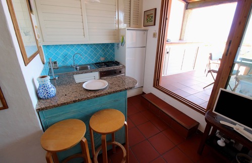 Golfo di Marinella Apartment | Beachside Marineled Apartment with Pool & Ocean View