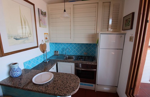 Golfo di Marinella Apartment | Beachside Marineled Apartment with Pool & Ocean View