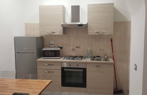 San Martino Apartment | Cozy Flat Martino: Child-Friendly with Kitchen Amenities