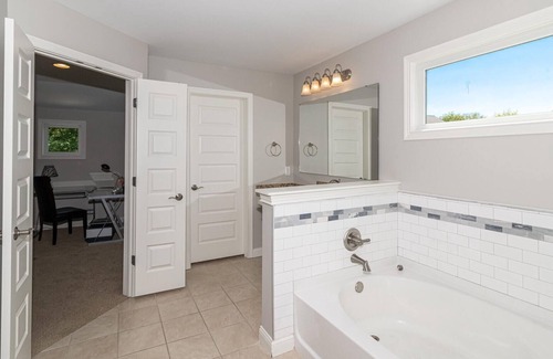 Maxwell House | Master bedroom with lake view Fishers