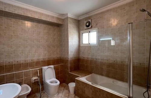 Doha Apartment | Elegant Master Bedroom with Pool & Entertainment Facilities