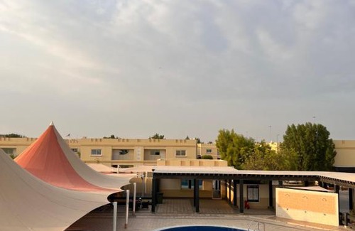 Doha Apartment | Elegant Master Bedroom with Pool & Entertainment Facilities