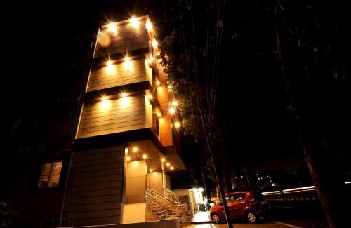 Mysore Hotel | Family-Friendly MC Suites Mysuru with Restaurant & Kitchen