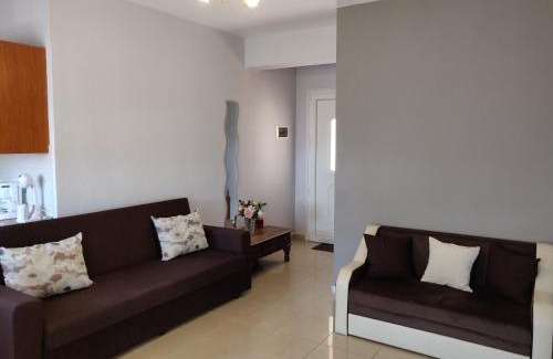 Chrisi Akti Apartment | Elegant Methexis Apartment with Oceanfront Views & Hot Tub