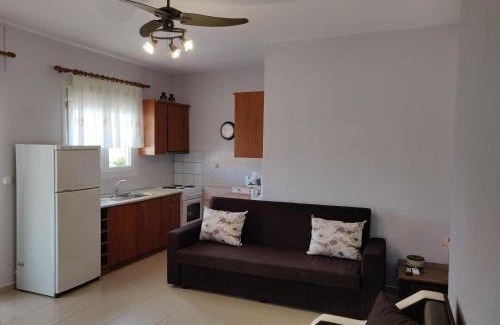 Chrisi Akti Apartment | Elegant Methexis Apartment with Oceanfront Views & Hot Tub