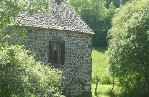 Le Falgoux House | Picturesque Mill Retreat by the Water with Spa & Breakfast