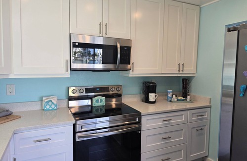 Treasure Island Villa | Discover Your Paradise: Waterfront Duplex with Pool & Dock