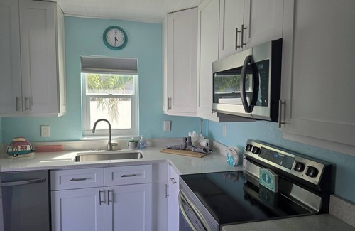 Treasure Island Villa | Discover Your Paradise: Waterfront Duplex with Pool & Dock