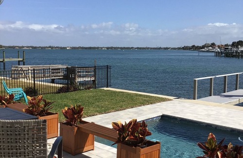 Treasure Island Villa | Discover Your Paradise: Waterfront Duplex with Pool & Dock