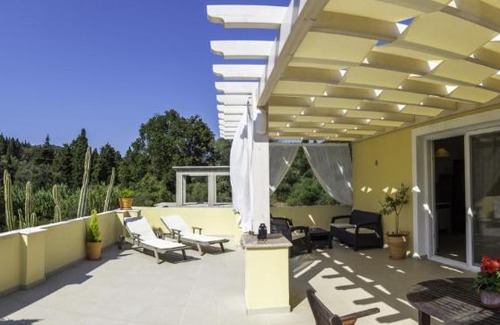 Agios Georgios Pagon Apartment | Seaside Comfort at Miltiadis Apartments - Rated 9/10