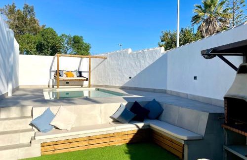 Chiclana de la Frontera Ski Chalet | Enjoy Comfort at Minichalet El Molino 1 - Pet Friendly Retreat