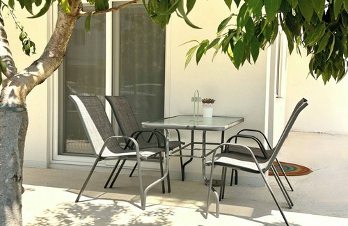 Olymbiaki Akti Apartment | Seaside Getaway: The Evergreen Apartment with Private Patio
