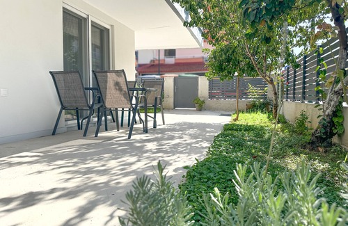 Olymbiaki Akti Apartment | Seaside Getaway: The Evergreen Apartment with Private Patio