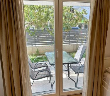 Olymbiaki Akti House | Seaside Apartment with Private Patio and Ocean View