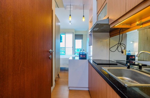 Kayu Putih Apartment | Modern Studio with City Views and Pool at Tifolia Apartment