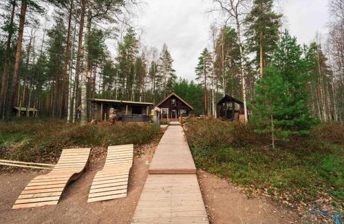 Loppi Ski Chalet | Beautiful Retreat with Hot Tub and Private Beach Access