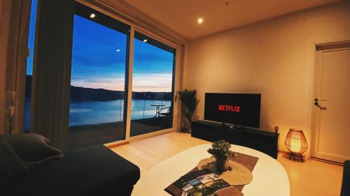 Brumunddal Apartment | Scenic MJOS TOWER Suite with Private Pool & Lake Views