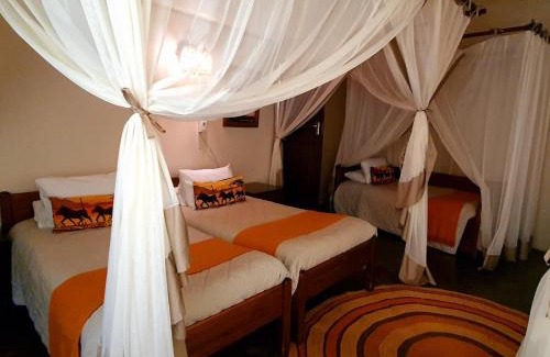 Lobamba Cabin | Discover Mlilwane Game Sanctuary with Pool & Family Amenities