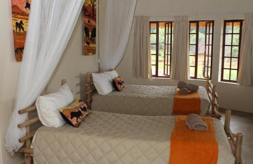 Lobamba Cabin | Discover Mlilwane Game Sanctuary with Pool & Family Amenities