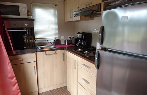 Dinard House | Inviting Mobile Home with Pool & Tennis Court Open Year-Round