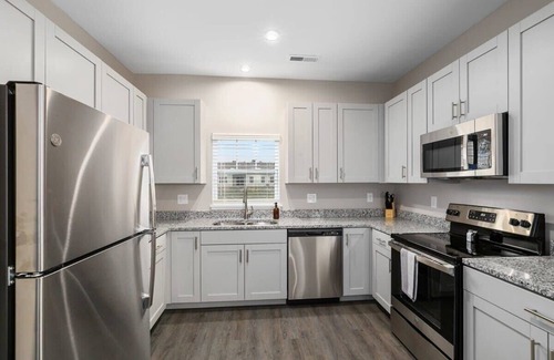 Grandville Apartment | Stylish 4BR Condo with Garage, Patio & Pet-Friendly Perks