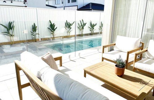 Pelican Waters House | Modern Boho Retreat with Pool, Yard & Beaches Just Minutes Away