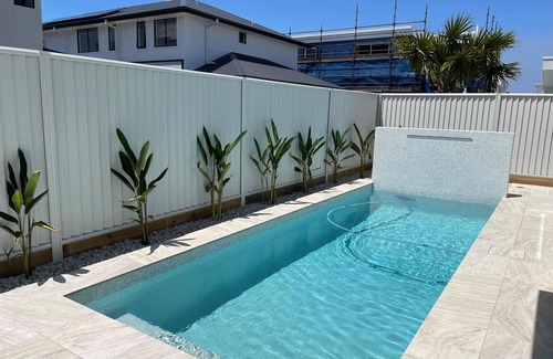 Pelican Waters House | Modern Boho Retreat with Pool, Yard & Beaches Just Minutes Away