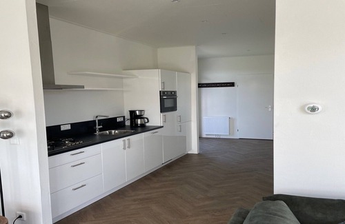 Lathum Ski Chalet | Modern Chalet in Lathum with Pool and Kitchen Amenities
