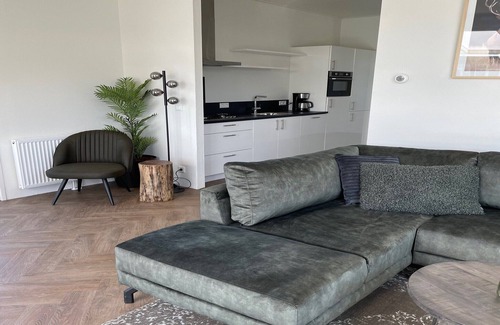 Lathum Ski Chalet | Modern Chalet in Lathum with Pool and Kitchen Amenities